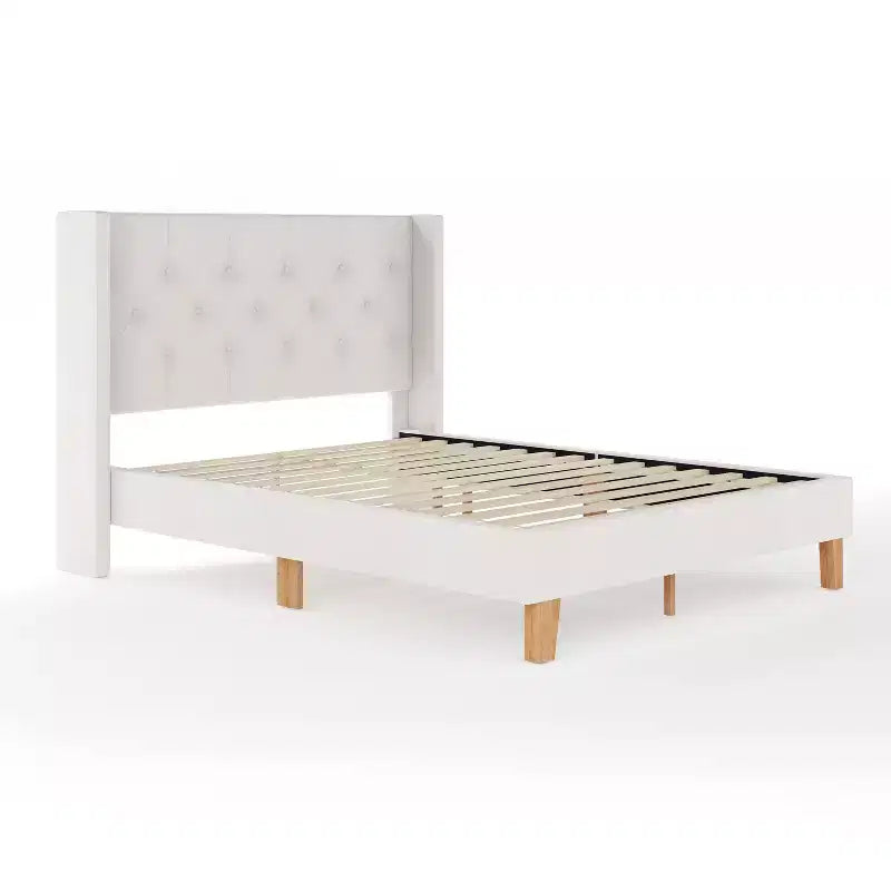 Lit plateforme rembourré avec tête de lit capitonnée à oreilles et longerons latéraux matelassés